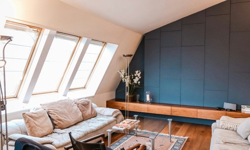 Photo by Emily Wang beige 3-seat sofa near the window